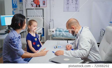 Doctor changing the treatment Doctor changing the treatment 72088202