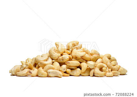 Some cashews piled up on a white background 72088224