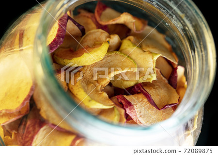 Dried apples in a jar as a background. Dried apples in a jar as a background. 72089875