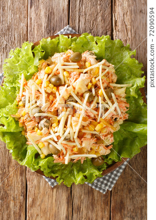 Brazilian Chicken Salad Salpicao de Frango closeup in the plate. vertical top view 72090594