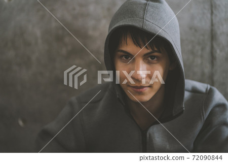 Man wearing a hood 72090844