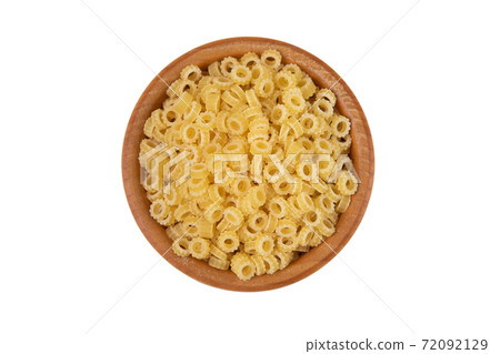 pasta in wooden bowl isolated on white 72092129