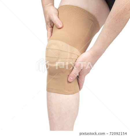 bandage for fixing the injured knee of the human leg on a white background. medicine and sports. 72092154