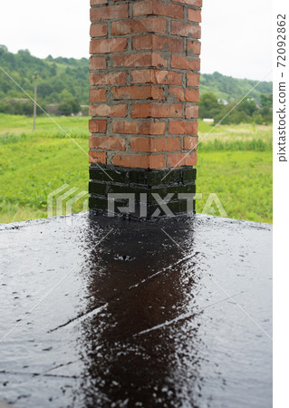 the terrace is covered with a layer of waterproofing mastic 72092862