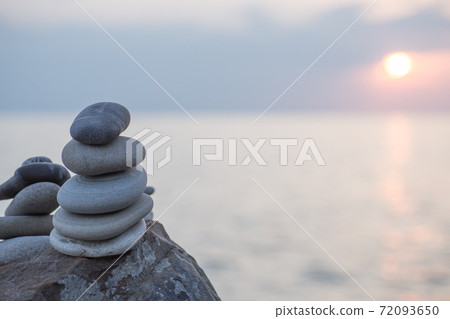 Stones pyramid on sand symbolizing zen, harmony, Stones pyramid on sand symbolizing zen, harmony, 72093650