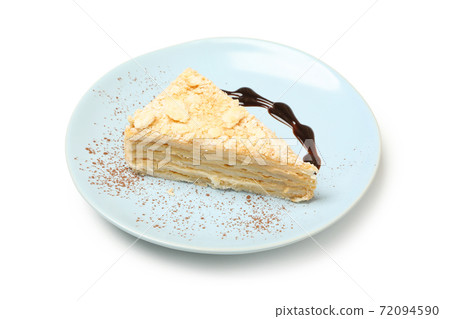 Plate with piece of Napoleon cake isolated on white background Plate with piece of Napoleon cake isolated on white background 72094590