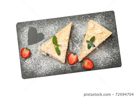 Board with pieces of Napoleon cake isolated on white background Board with pieces of Napoleon cake isolated on white background 72094704