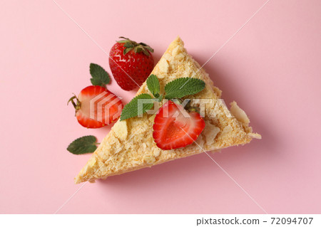 Piece of delicious Napoleon cake on pink background Piece of delicious Napoleon cake on pink background 72094707