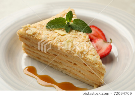Plate with delicious Napoleon cake on white - gray background Plate with delicious Napoleon cake on white - gray background 72094709