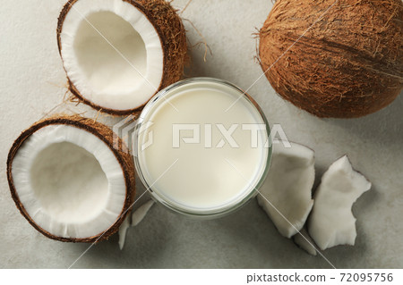 Fresh coconut and coconut milk on white background 72095756