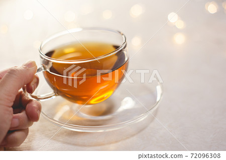 Hands up for women drinking tea. Home time, break time. 72096308