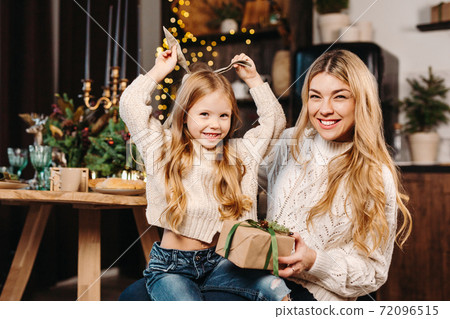 cheerful family spending Christmas time together at home cheerful family spending Christmas time together at home 72096515