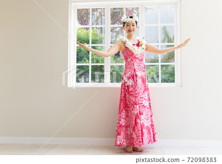 A woman making a hula dance A woman making a hula dance 72098383