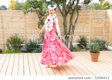 A woman making a hula dance A woman making a hula dance 72098412