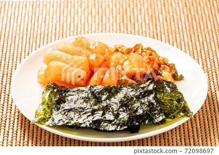 Assorted Korean-style snacks. Korean seaweed, kakuteki (radish kimchi), Chinese cabbage kimchi. 72098697