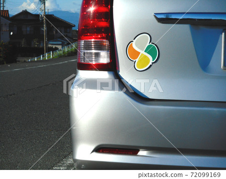 Elderly driver sign (elderly mark) attached to the back of the car 72099169