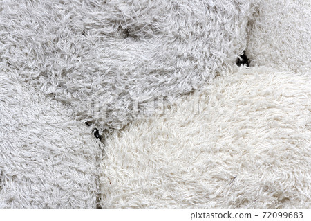 Rolls of factory textiles close-up. Raw material or material for making rags. 72099683