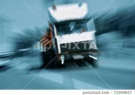 Truck in a blur on the road in motion. The danger of a collision or emergency situation. Violation of rules by truckers Truck in a blur on the road in motion. The danger of a collision or emergency situation. Violation of rules by truckers 72099687