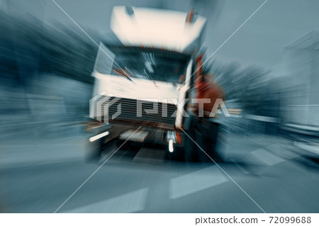 Truck in a blur on the road in motion. The danger of a collision or emergency situation. Violation of rules by truckers 72099688