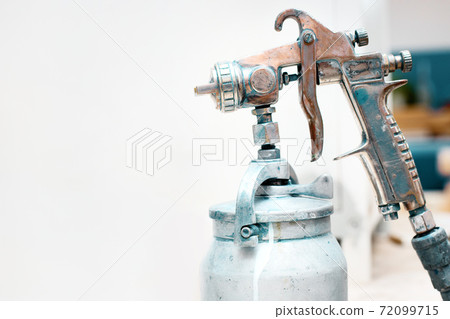 spray gun close-up. tool for industrial painting of materials and iron. spray gun close-up. tool for industrial painting of materials and iron. 72099715