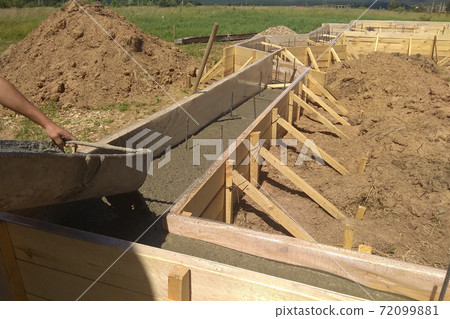 close up view of reinforcement of concrete with metal rods connected by wire 72099881