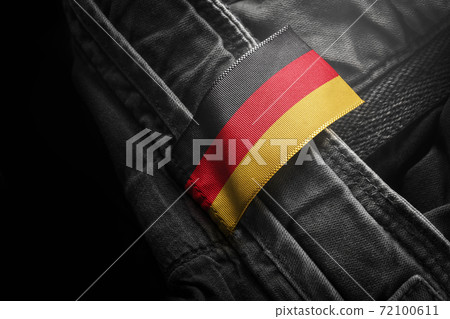 Tag on dark clothing in the form of the flag of the Germany 72100611