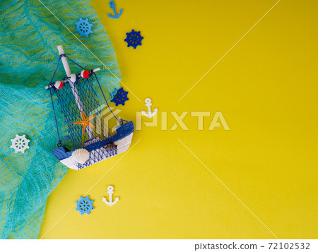 small boat on a yellow background, the concept of recreation and summer 72102532