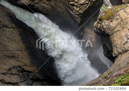 View closeup waterfall of Trmmelbach fall in mountains, valley of waterfalls 72102904
