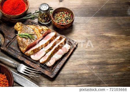 Beef grill with spices on a cutting Board. 72103666