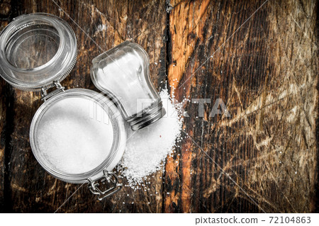 Salt in a glass jar. 72104863