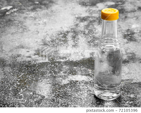 bottle of vinegar. 72105396