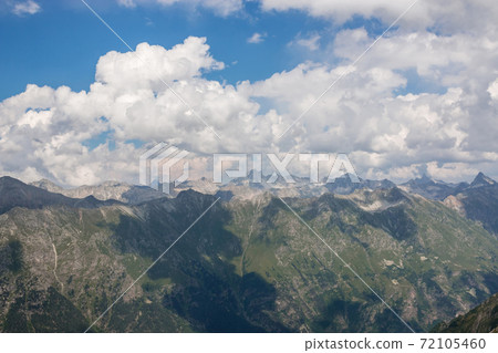 Panorama of mountains scene with dramatic cloudy sky in national park of Dombay 72105460