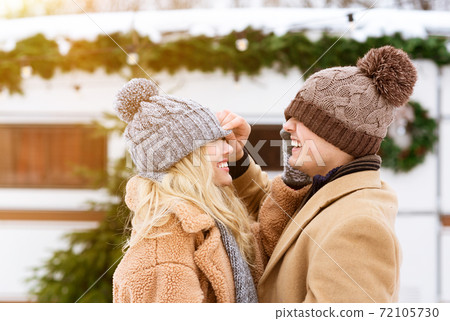 Romantic Moments. Loving Young Couple Having Fun During Winter Date Outdoors Romantic Moments. Loving Young Couple Having Fun During Winter Date Outdoors 72105730