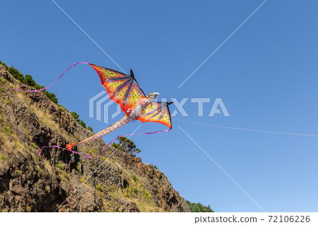 A Dragon Kite fly in the blue sky A Dragon Kite fly in the blue sky 72106226