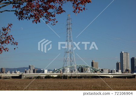 Autumn riverbank and tower 72106904