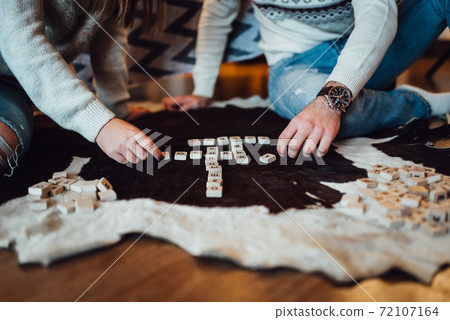 a guy and a girl celebrate the new year together. and give each other gifts a guy and a girl celebrate the new year together. and give each other gifts 72107164