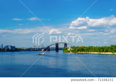 KYIV, UKRAINE - MAY 23, 2017 View of the Dnieper embankment, River station, grand hotel Fairmont in Kiev KYIV, UKRAINE - MAY 23, 2017 View of the Dnieper embankment, River station, grand hotel Fairmont in Kiev 72108231