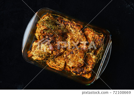 Pork fillet baked in oven with seasoning and herbs 72108669