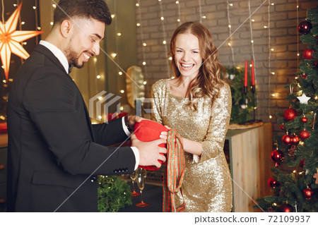 Multi racial couple celebrate new year Multi racial couple celebrate new year 72109937