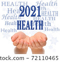 Health Happy new year greeting card 2021, health concept, text Health, greeting card 2021, woman's open palms of two hands with word HEALTH  and 2021 number above, surrounded by Health words and 72110465
