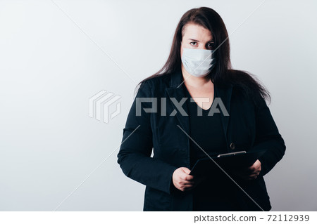 Business woman in face mask holding folder 72112939