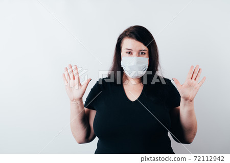 Confused shy clueless woman in medical mask Confused shy clueless woman in medical mask 72112942