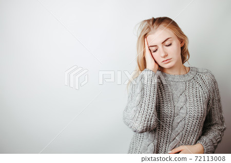 Worried, desperate woman suffering from headache 72113008