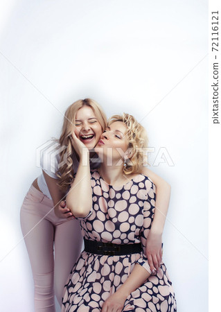 mother with teen daughter together posing happy smiling isolated on white background with copyspace, lifestyle people concept mother with teen daughter together posing happy smiling isolated on white background with copyspace, lifestyle people concept 72116121