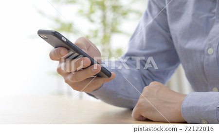 A man operating a smartphone 72122016