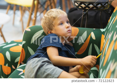 Little sad abused blond boy cowers away from camera. Family relationship, childhood problems and behaviour concept 72122823