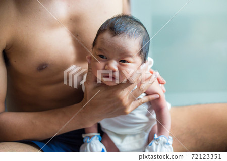 Infant baby boy belching after drink breast milk 72123351