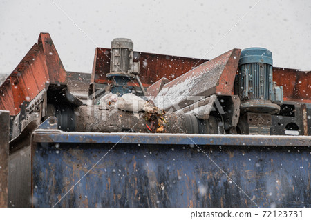 Moving conveyor transporter on Modern waste recycling processing plant. Separate and sorting garbage collection. Business for sorting and processing of waste. Moving conveyor transporter on Modern waste recycling processing plant. Separate and sorting garbage collection. Business for sorting and processing of waste. 72123731