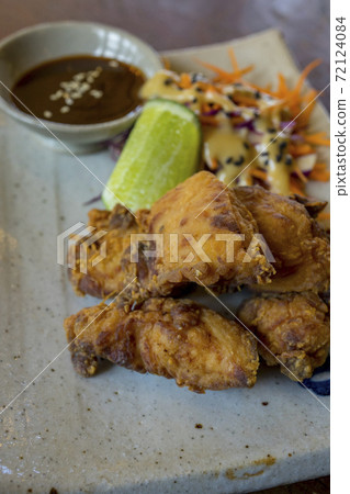 Spicy chicken karaage with lemon Spicy chicken karaage with lemon 72124084