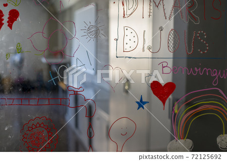 View of an empty classroom from the glass door View of an empty classroom from the glass door 72125692